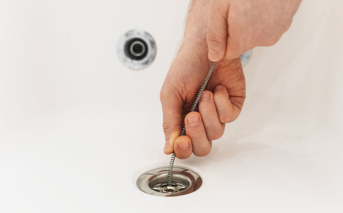 unclogging slow drain
