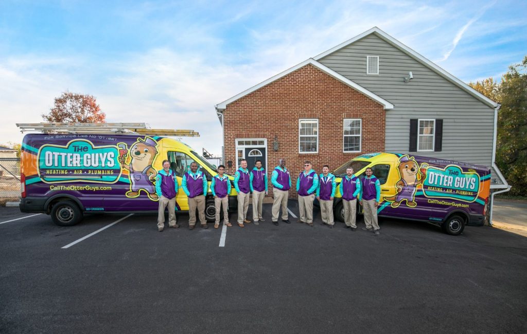 otter employees standing in front of van