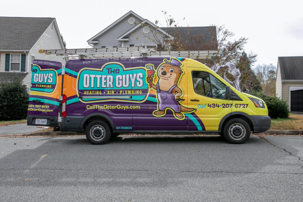 Otter Guys van parked in front of house.