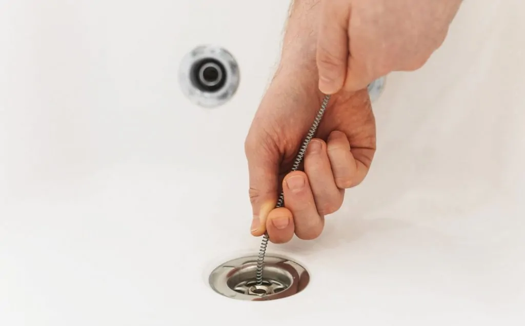 unclogging slow drain
